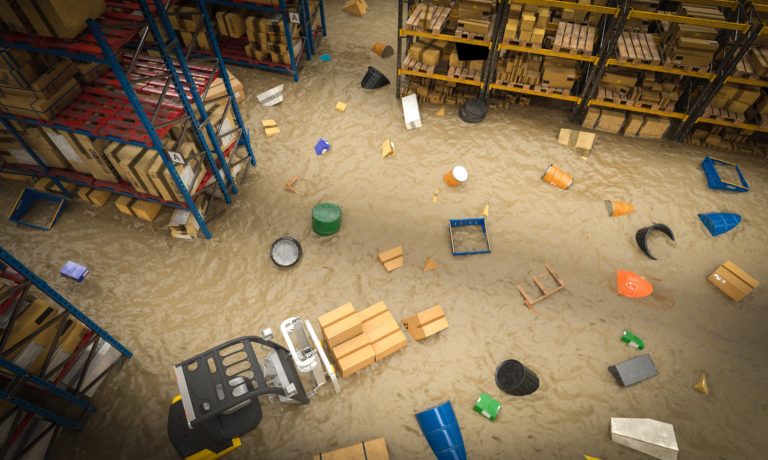 interior of a warehouse full of goods damaged by a flood of water
